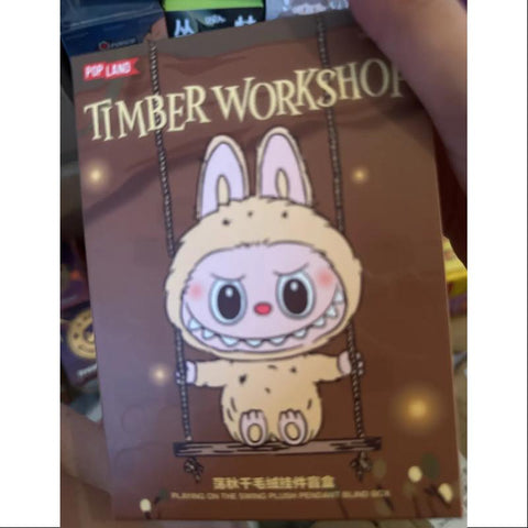 Labubu POP LAND TIMBER WORKSHOP PLAYING ON THE SWING PLUSH PENDANT Series Brown Labubu POP LAND TIMBER WORKSHOP PLAYING ON THE SWING PLUSH PENDANT Series Brown