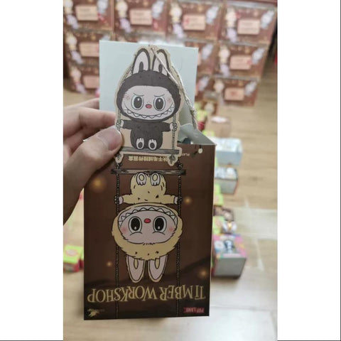 Labubu POP LAND TIMBER WORKSHOP PLAYING ON THE SWING PLUSH PENDANT Series SECRET Dark Brown Labubu POP LAND TIMBER WORKSHOP PLAYING ON THE SWING PLUSH PENDANT Series SECRET Dark Brown